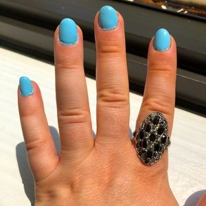 Silver detailed ring with black stones